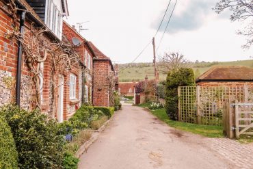 Old stone cottages alongside a country lane